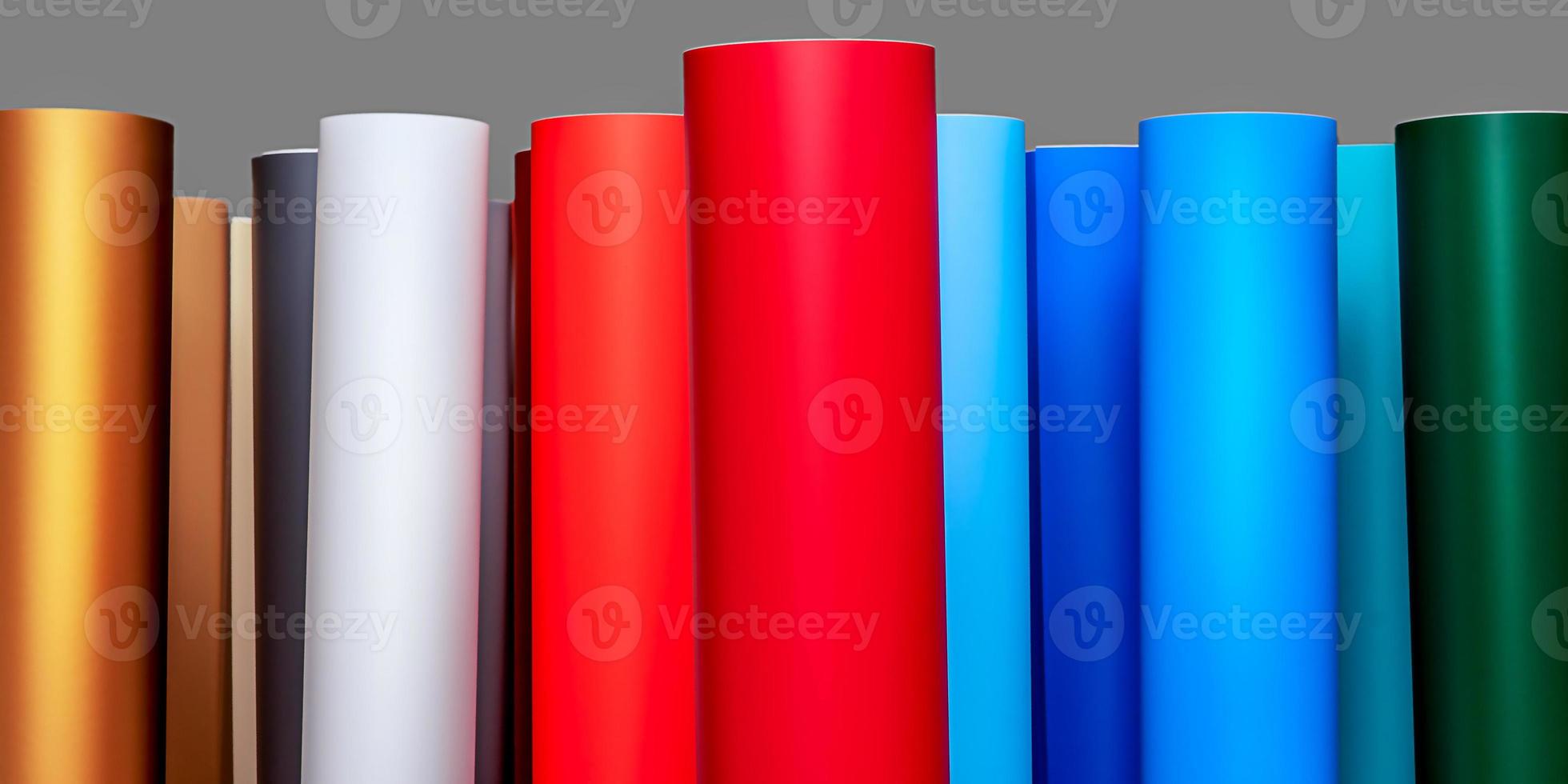 Vinyl self-adhesive film for advertising banners printing. Multi-colored roll. photo