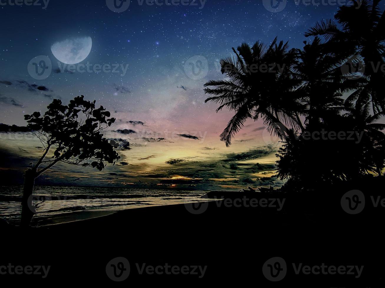 Evening sky in the beach with half moon photo