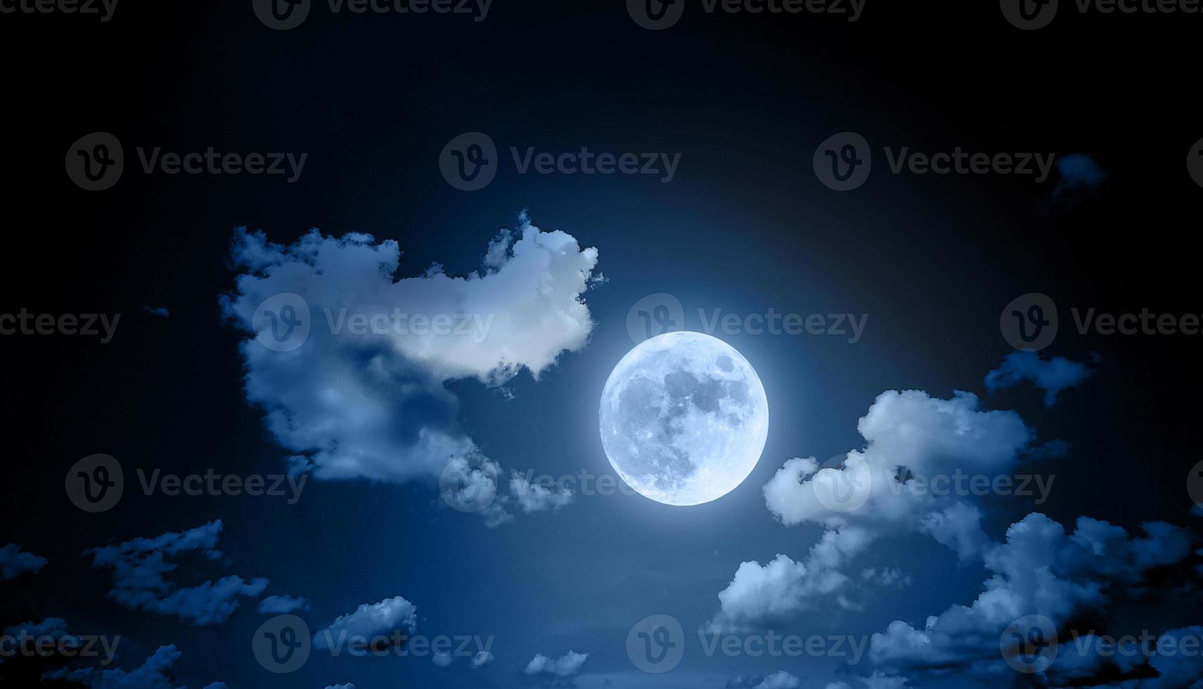 Night sky landscape with clouds and full moon photo