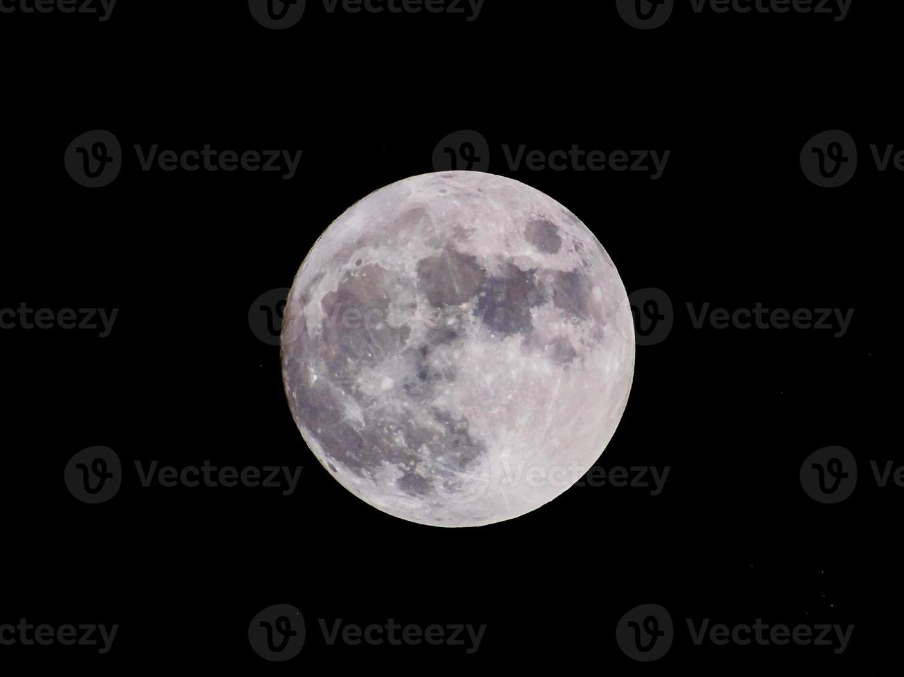 Full moon view in dark night sky photo