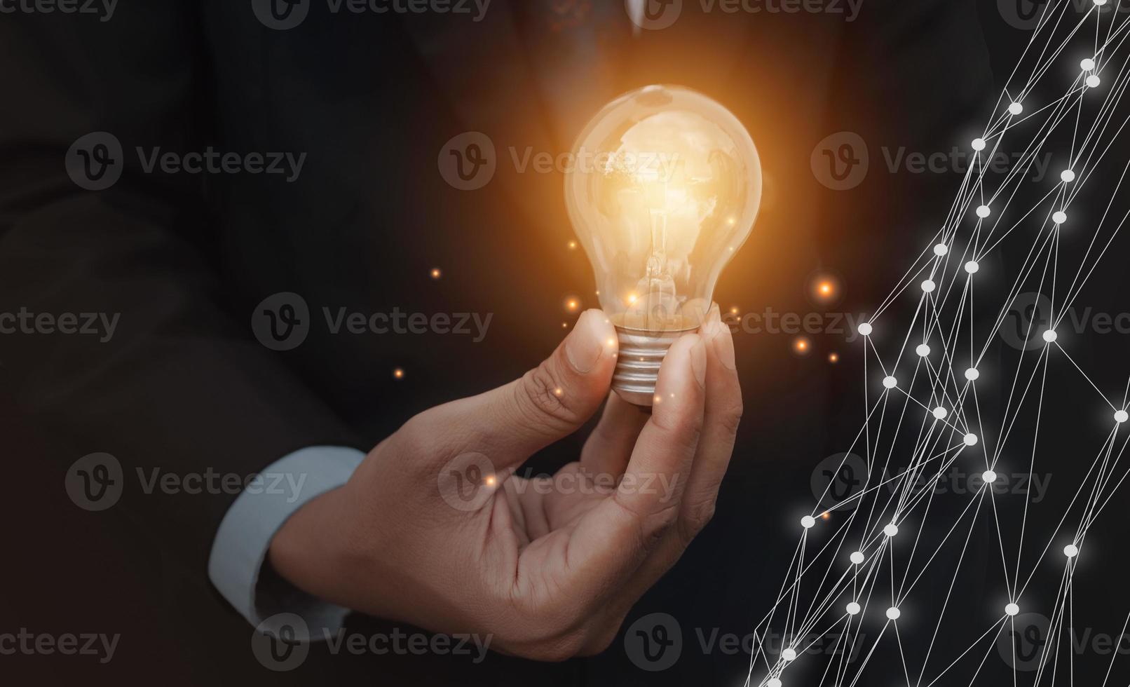 Hand holding light bulb Inspiration innovative technology. energy power concept idea. photo