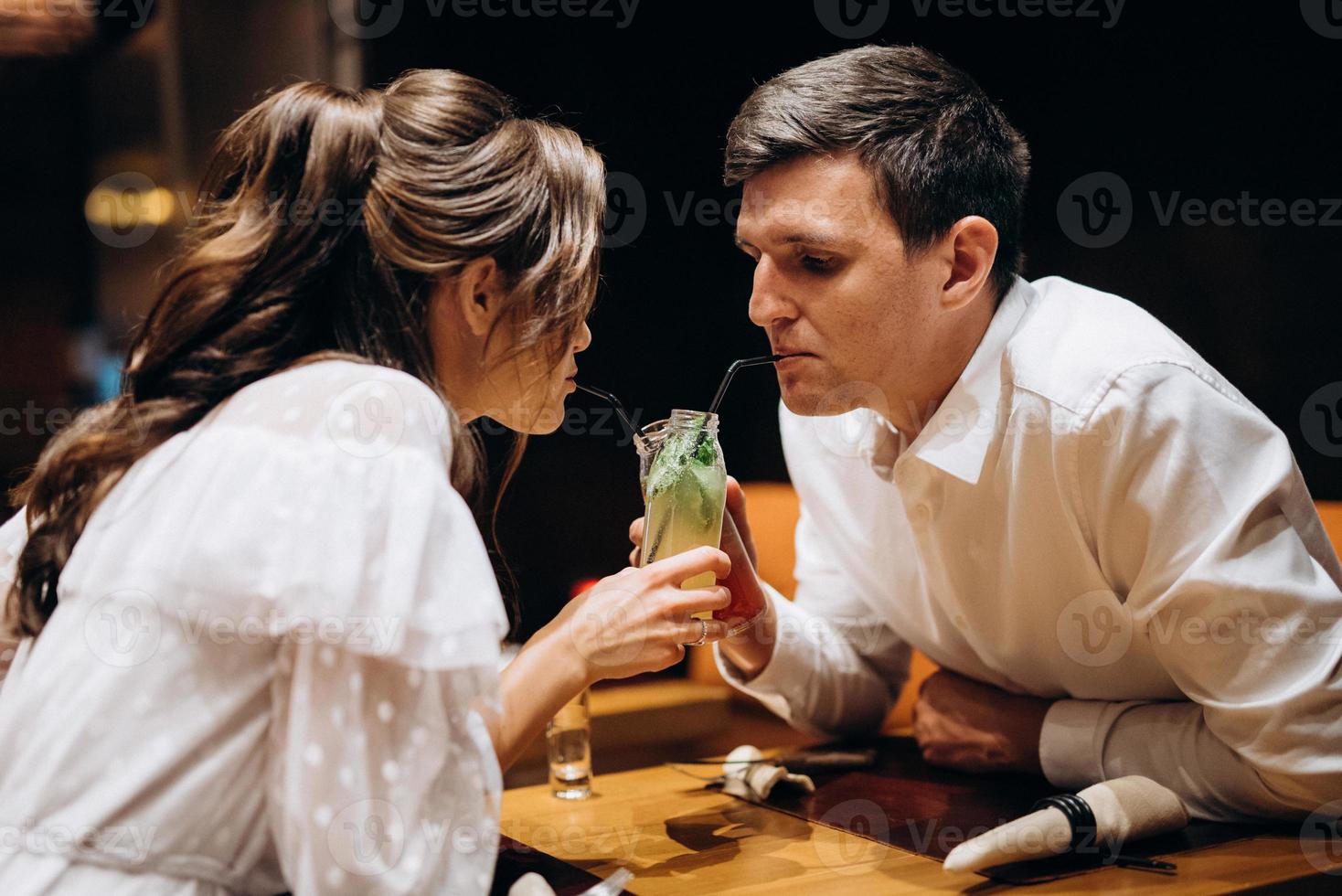 guy and a girl have lunch in a cafe photo