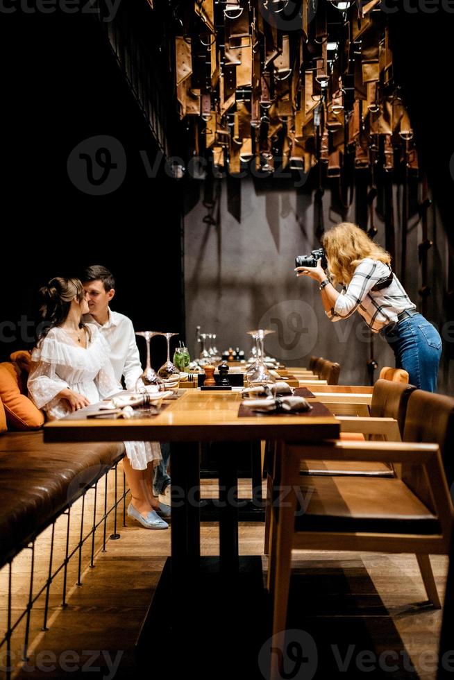 guy and a girl have lunch in a cafe photo