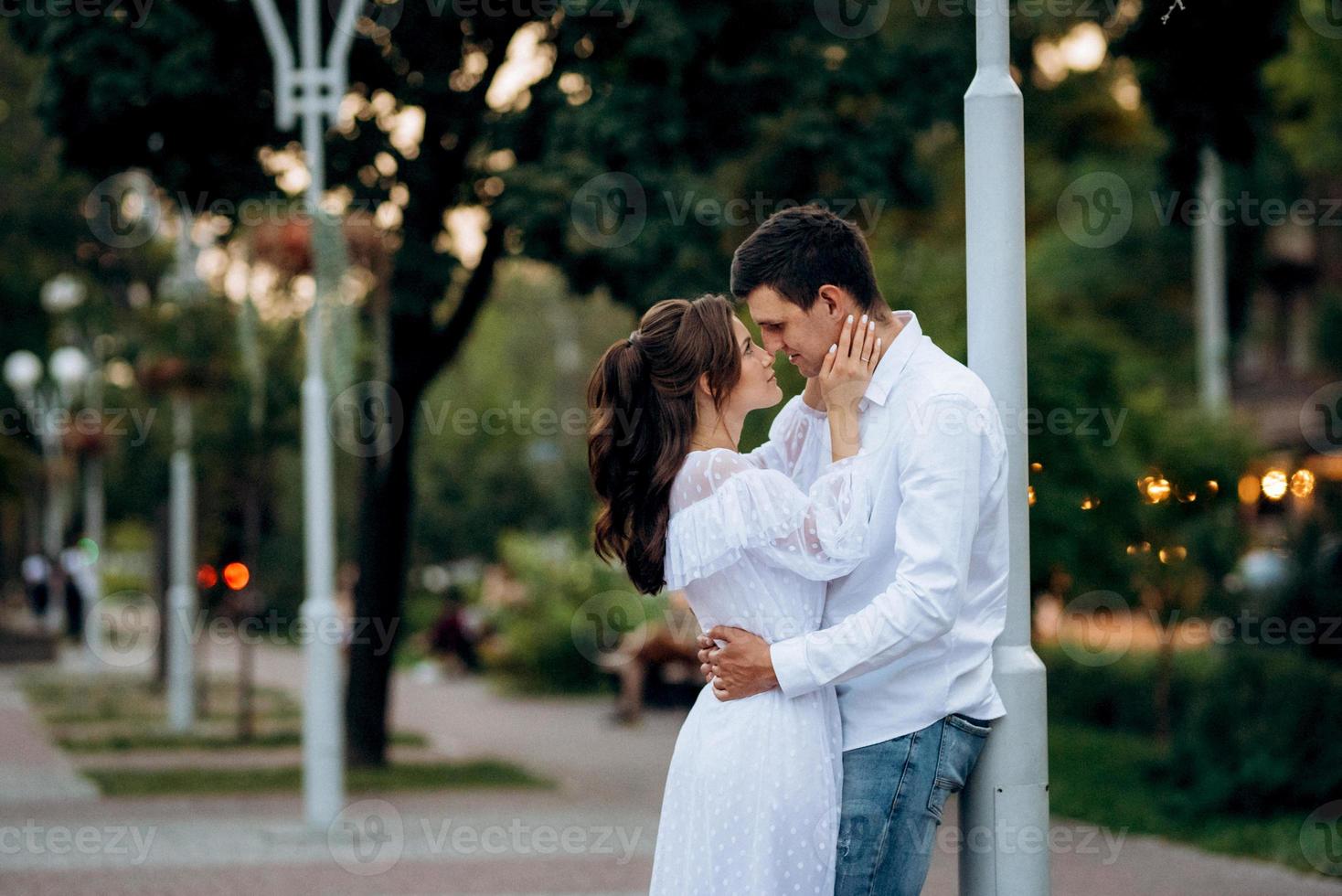 guy and a girl happily walk in the morning on the empty streets photo