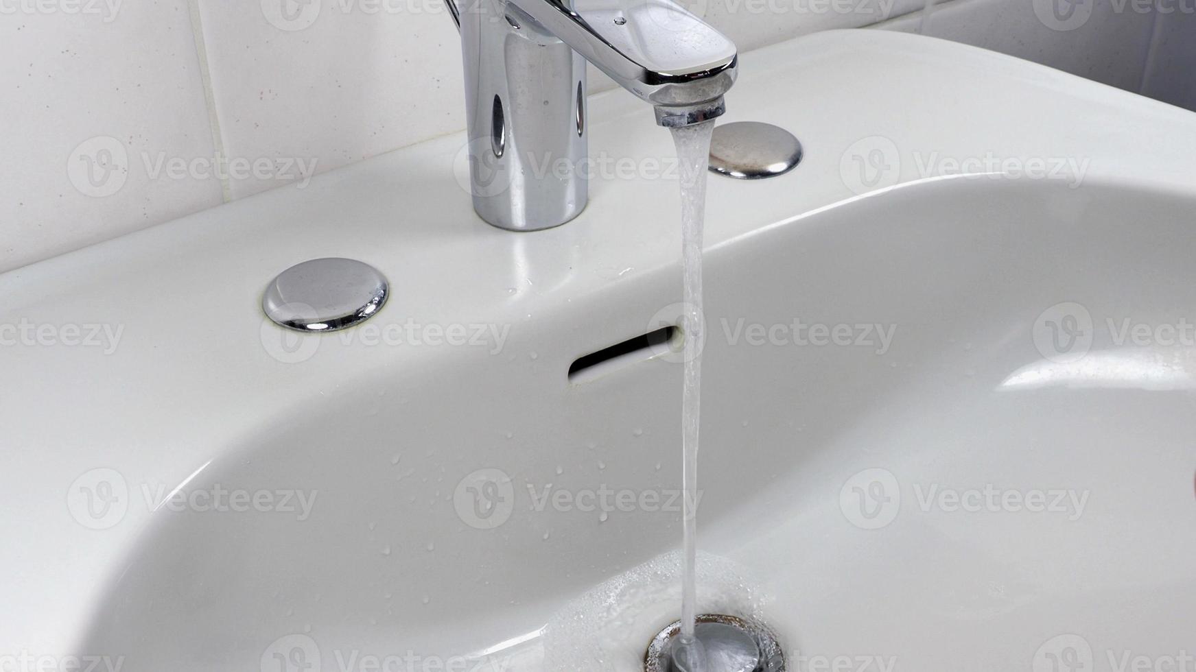 Unrecognisable person washing hands photo