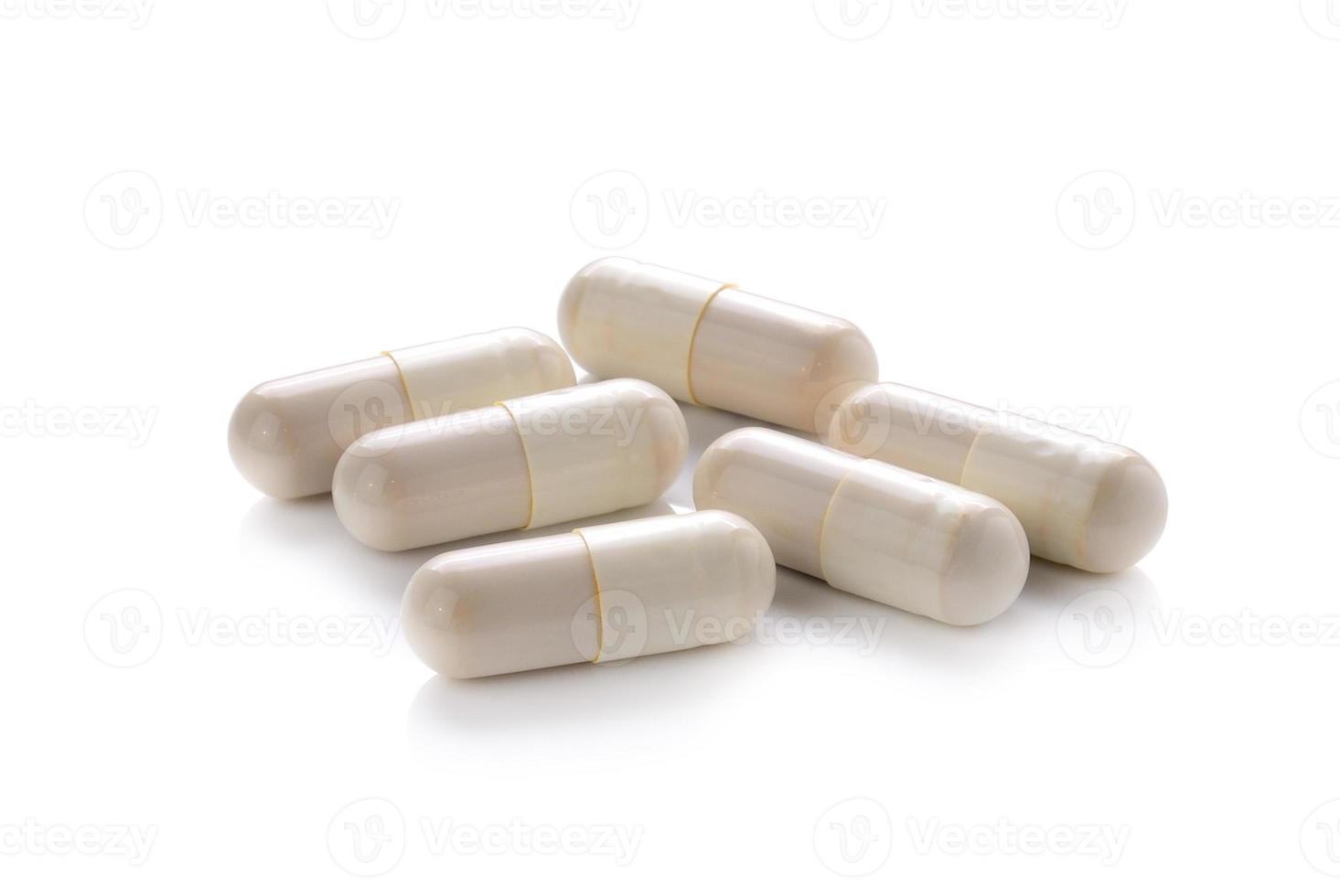 close up of pills capsule isolated on white background photo