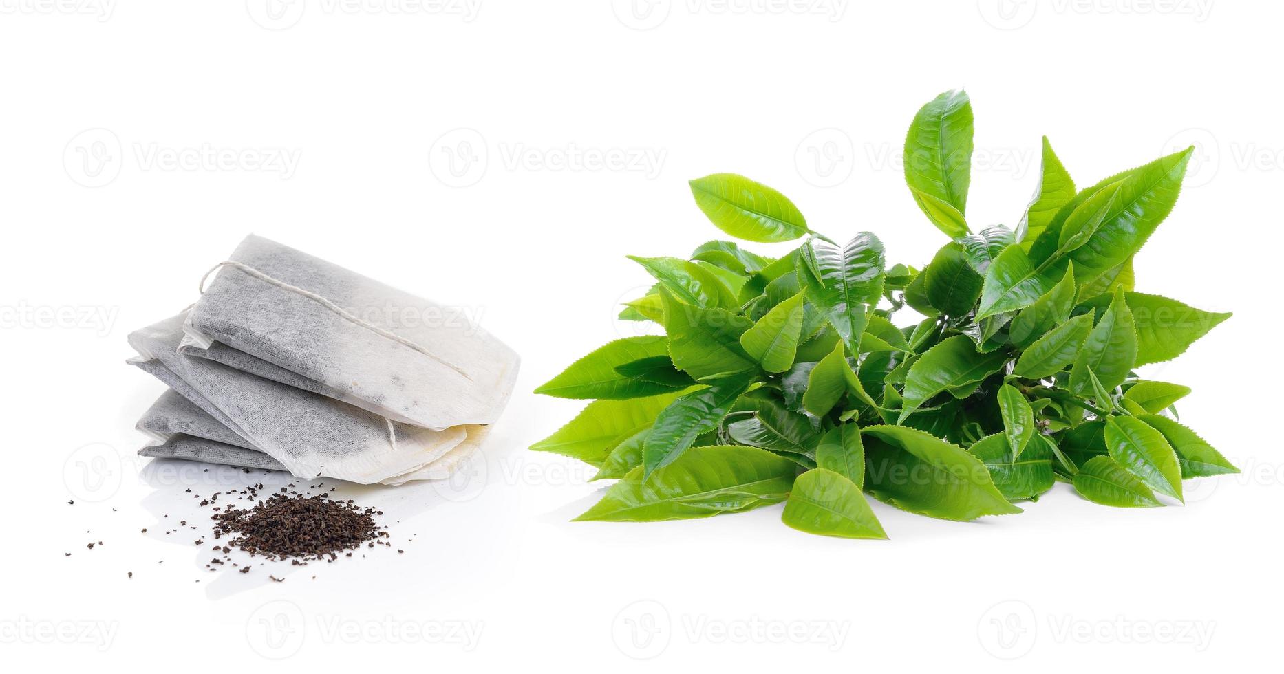 green tea leaf and teabag isolated on white background photo