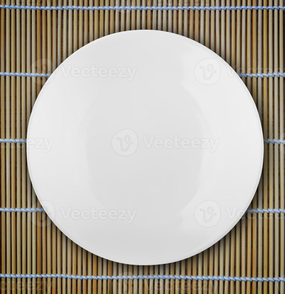 white empty bowl on a bamboo table photo