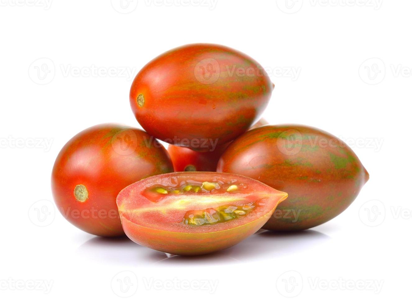 Chocolate Tomato or Brown color tomato on white background photo