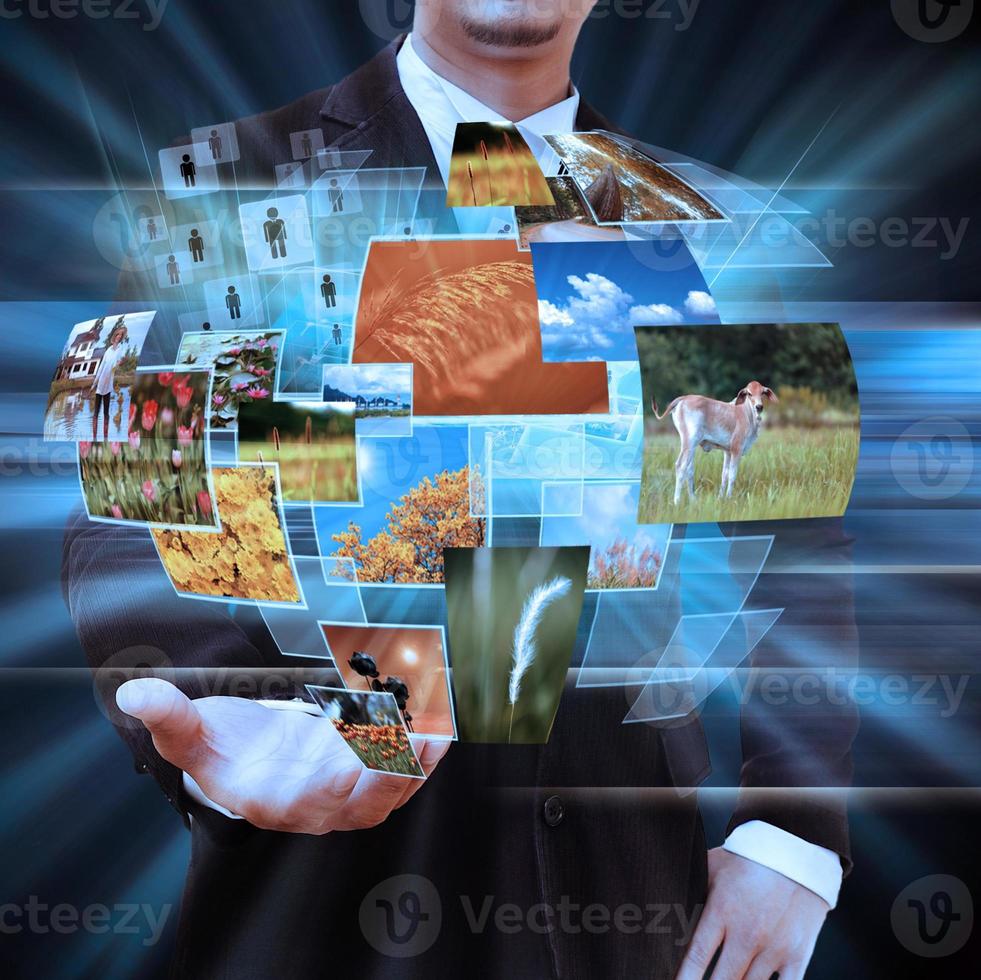 businessman holding social network photo