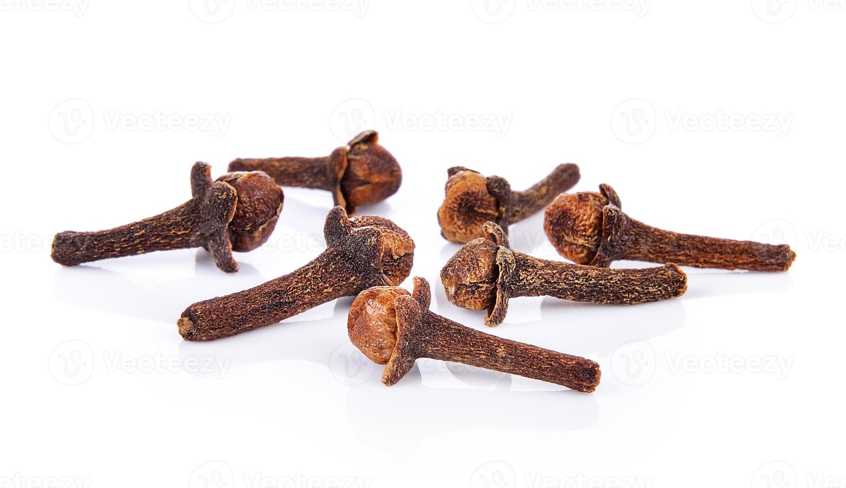 Spice cloves on white background photo