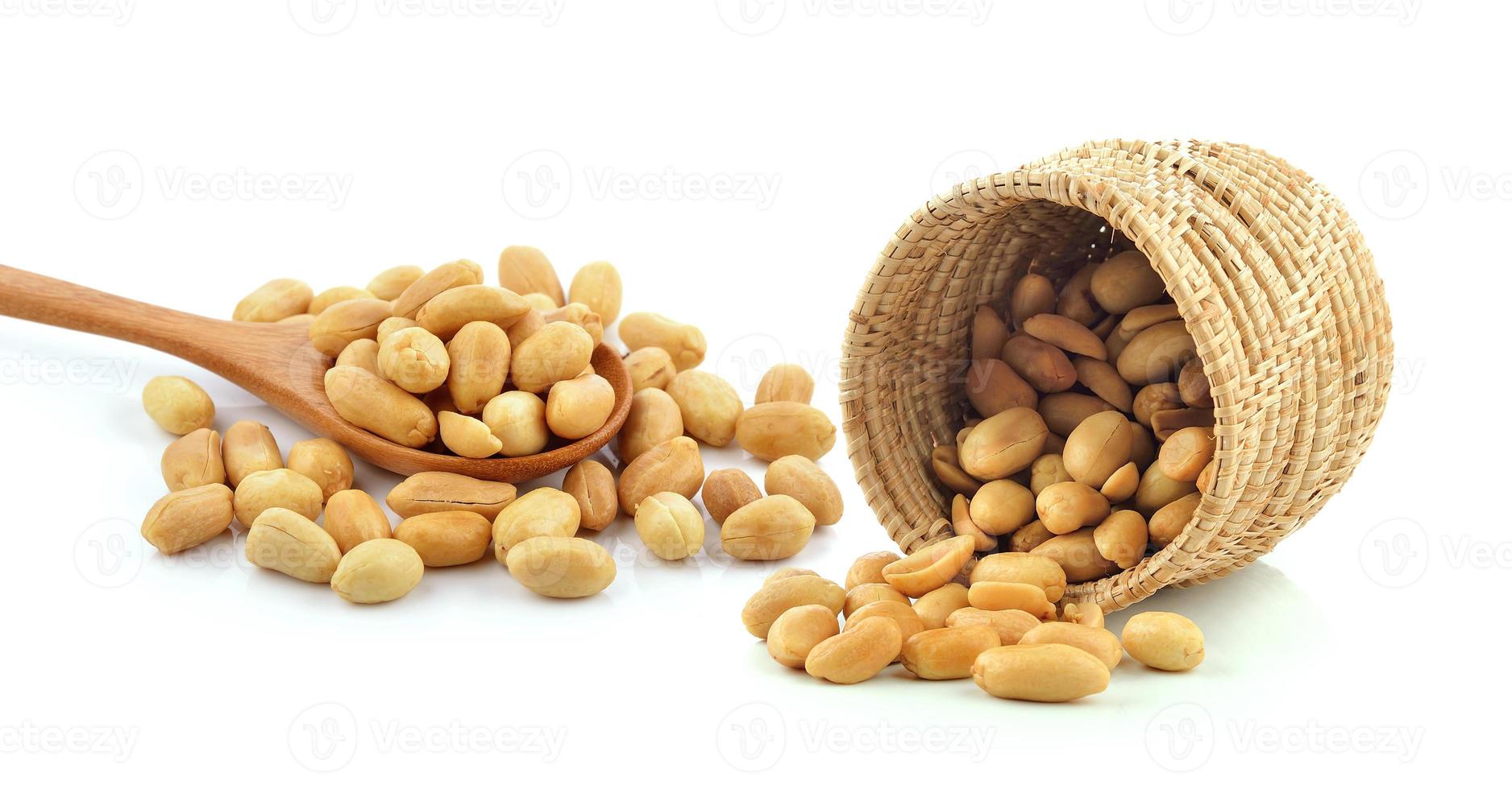 peanuts in the basket on white background photo