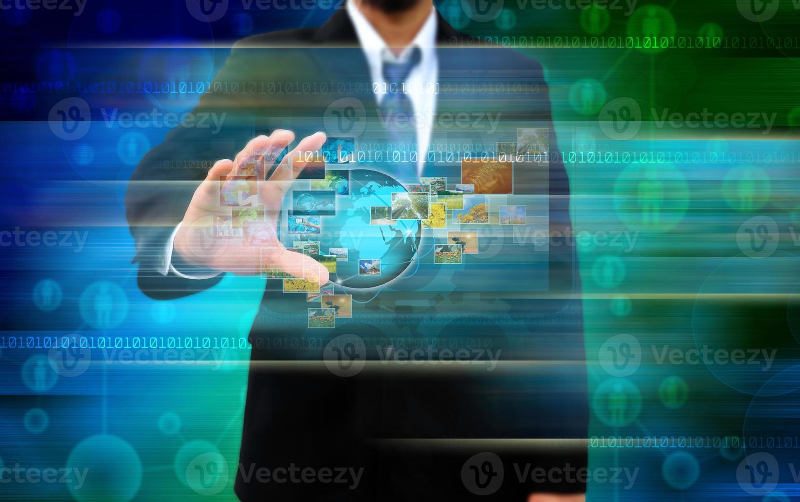 businessman holding Reaching images streaming in hands .Financial and technologies concepts photo