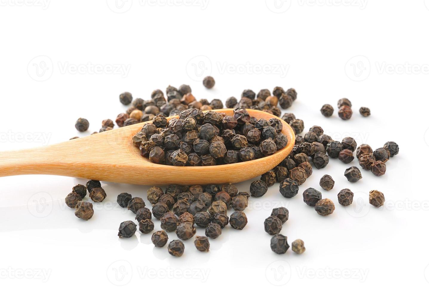 Spoon with Whole Black Pepper Granules photo