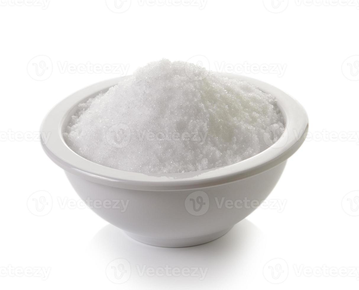 sea salt in a cup on white background photo