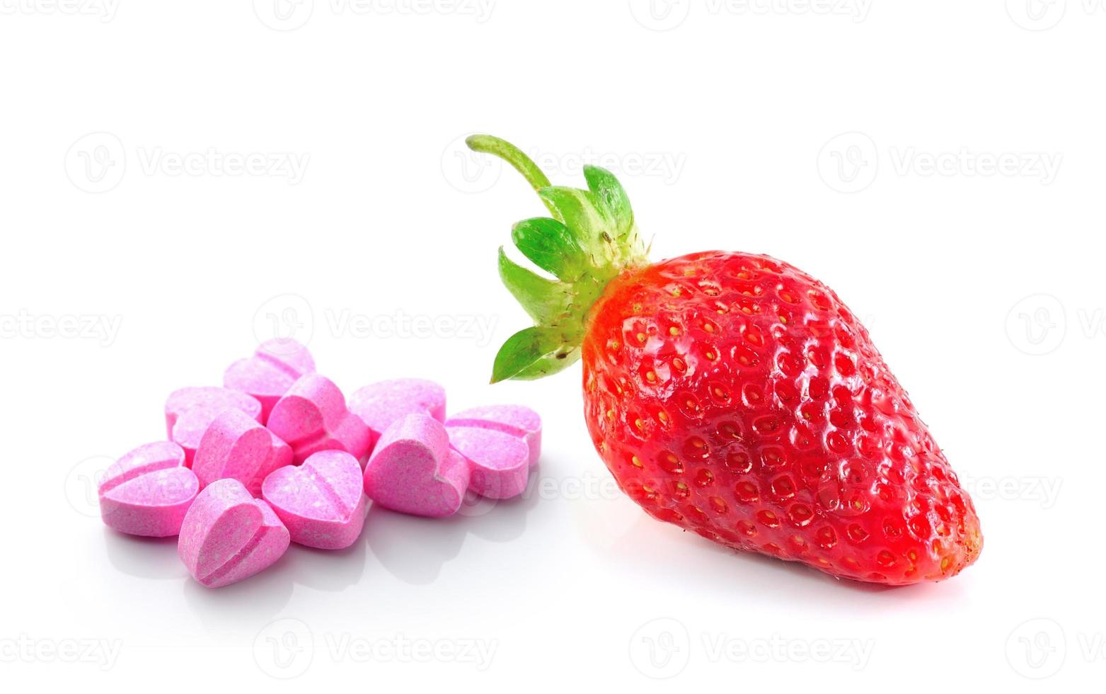 Strawberries berry and vitamin c isolated on white background photo