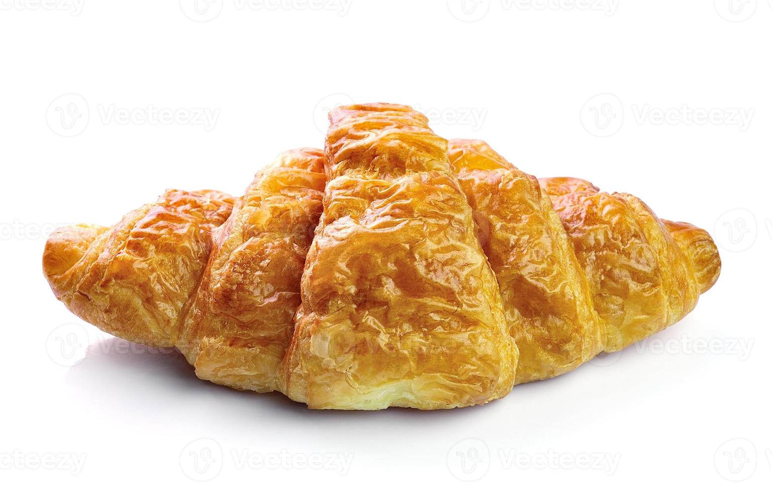 Fresh and tasty croissant over white background photo