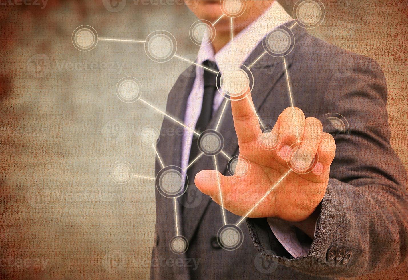 businessman pushing a touch screen interface in the old paper photo