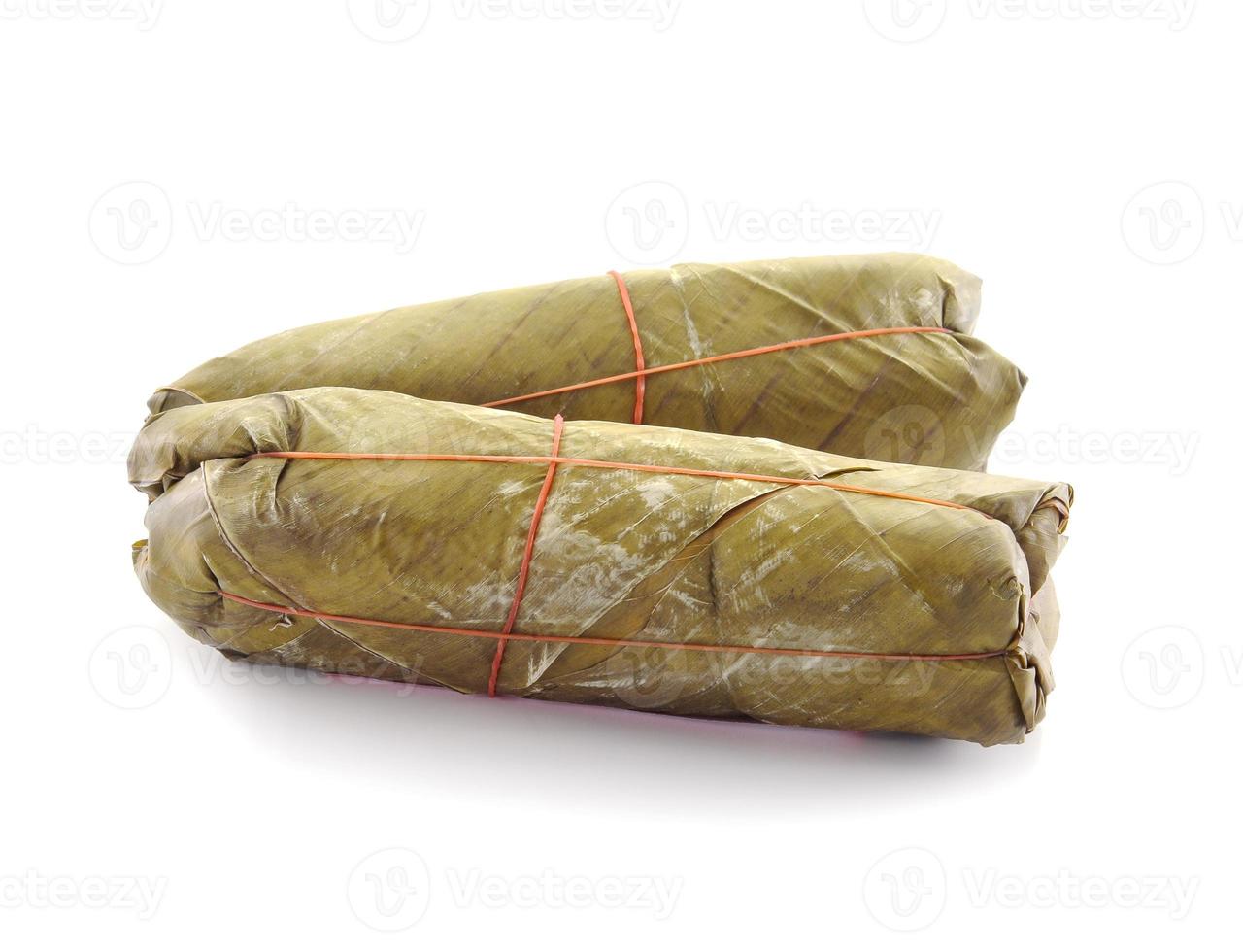 Pork wrapped in banana leaves. photo