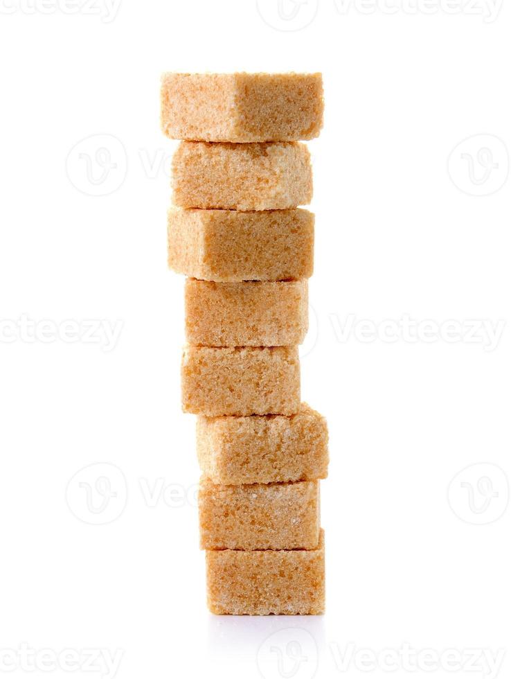 Cubes of cane sugar isolated on white background photo