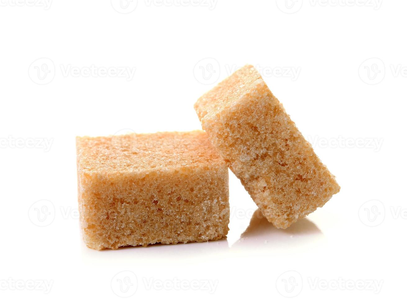 Cubes of cane sugar isolated on white background photo