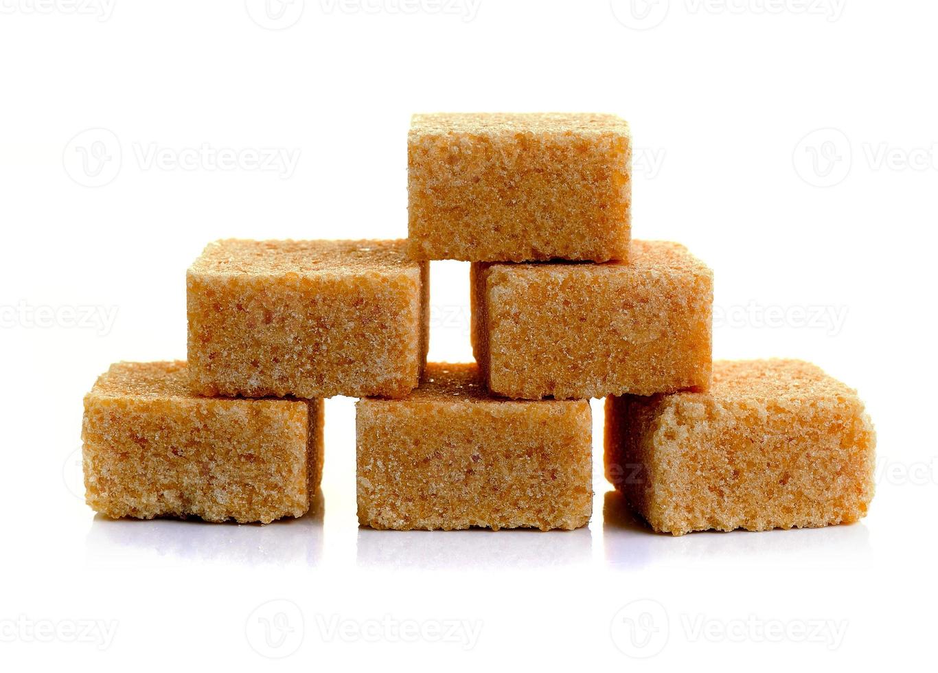 Cubes of cane sugar isolated on white background photo