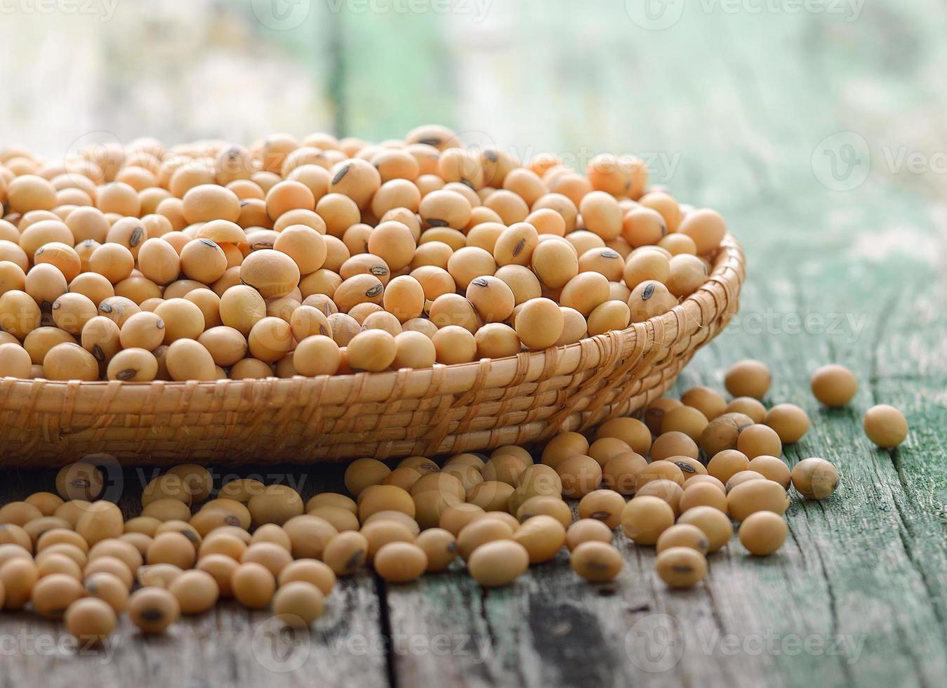 Soy beans in a basket on wooden photo