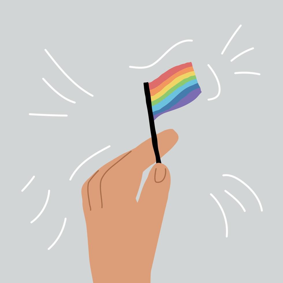 Multicolored flag in hand. A small flag of rainbow colors vector