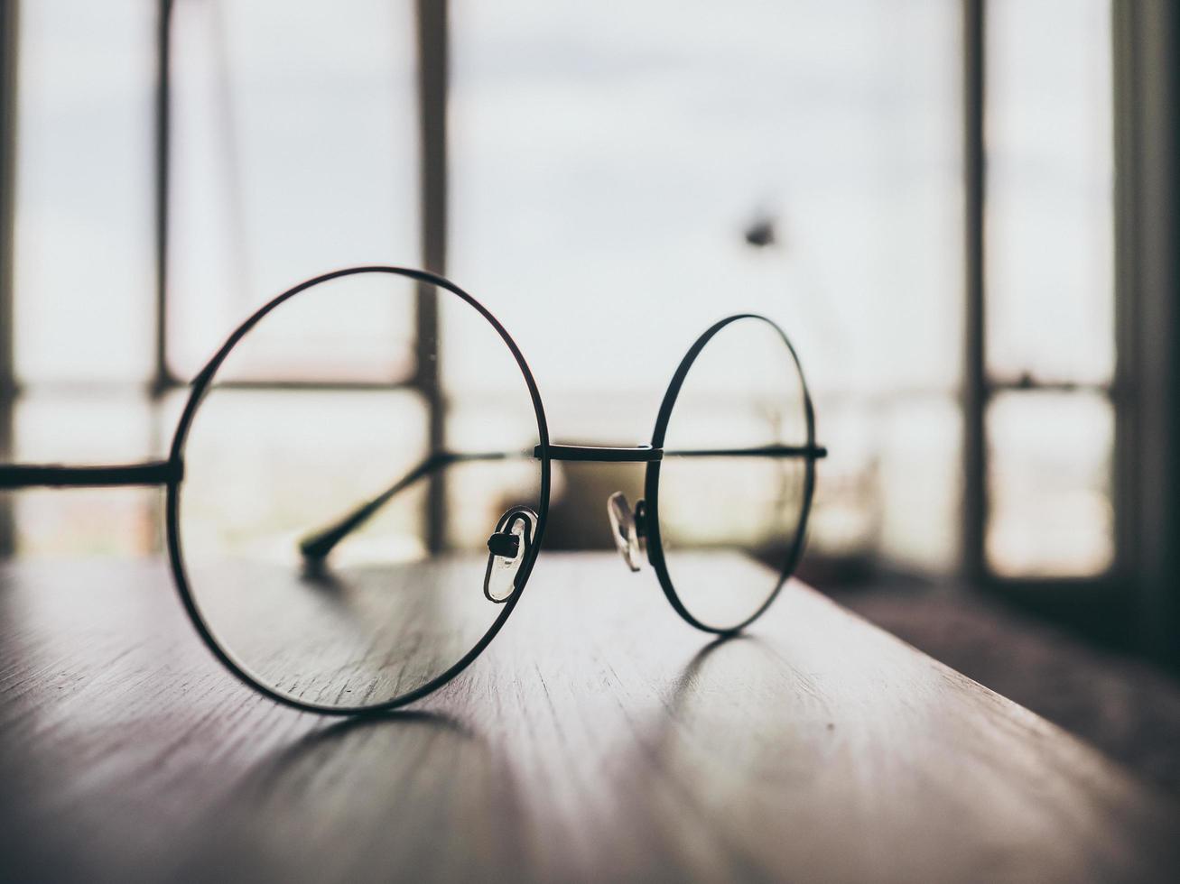 glasses on wooden table photo