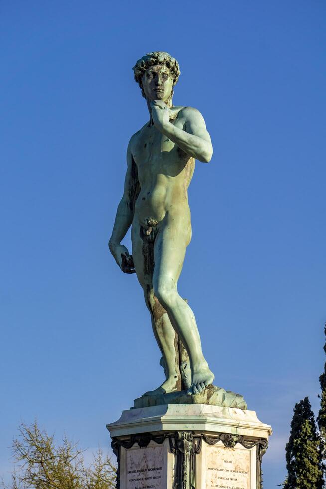 Statue of David by Michelangelo at Piazza Michelangelo in Florence, Italy photo