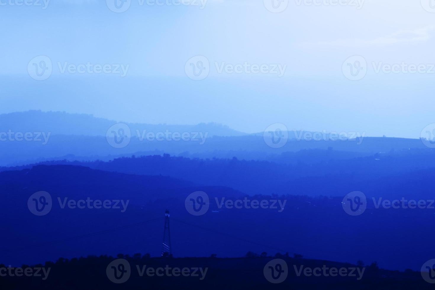Mountains summer landscape with blue colors gradient of mountain peaks, nature travel outdoor background. photo