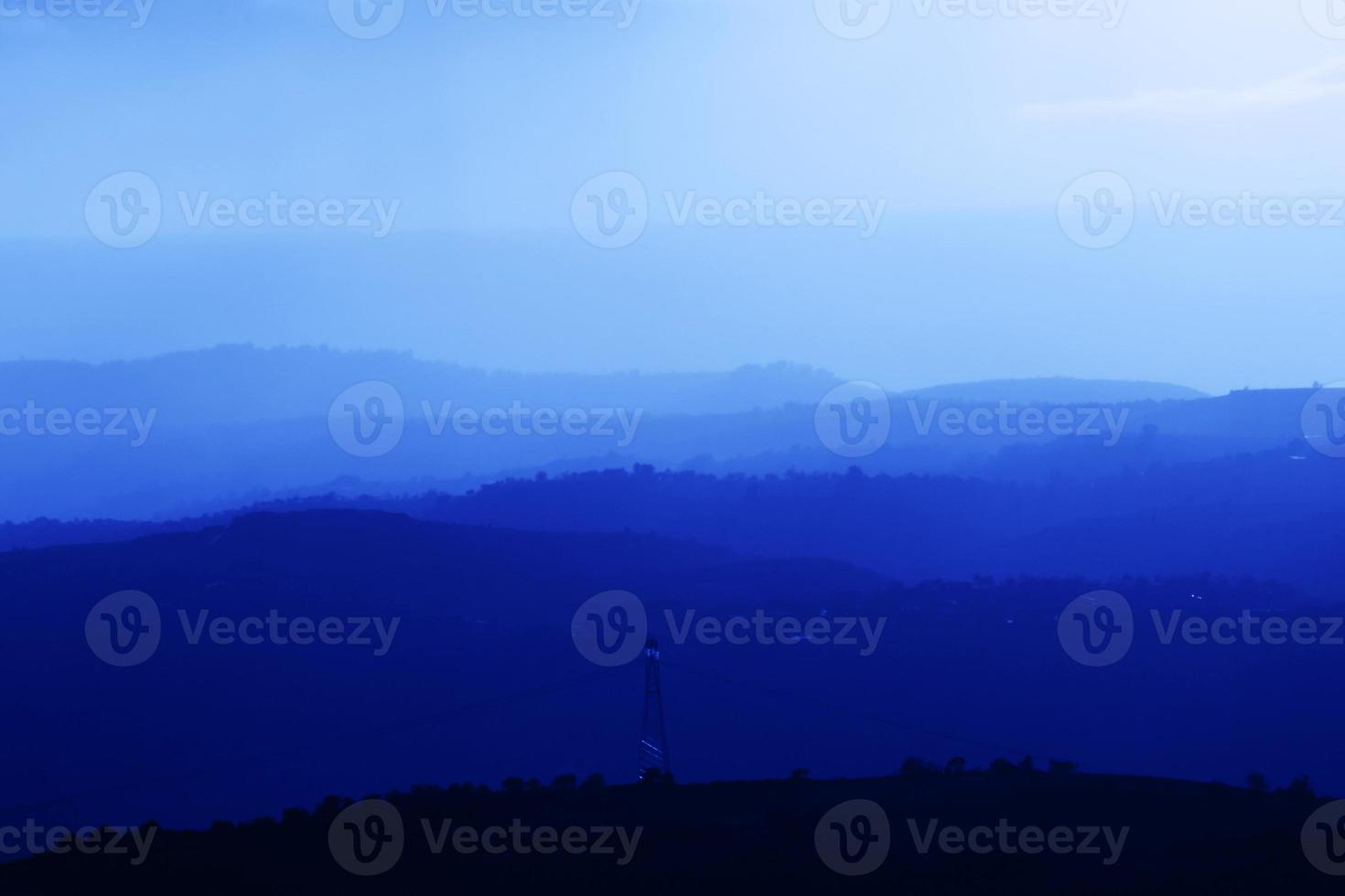 Mountains summer landscape with blue colors gradient of mountain peaks, nature travel outdoor background. photo