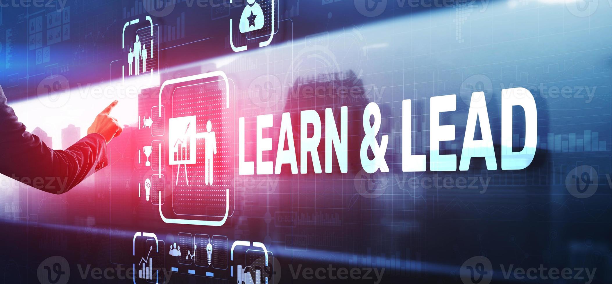 Learn and Lead. Businessman presses hand on the virtual screen inscription photo