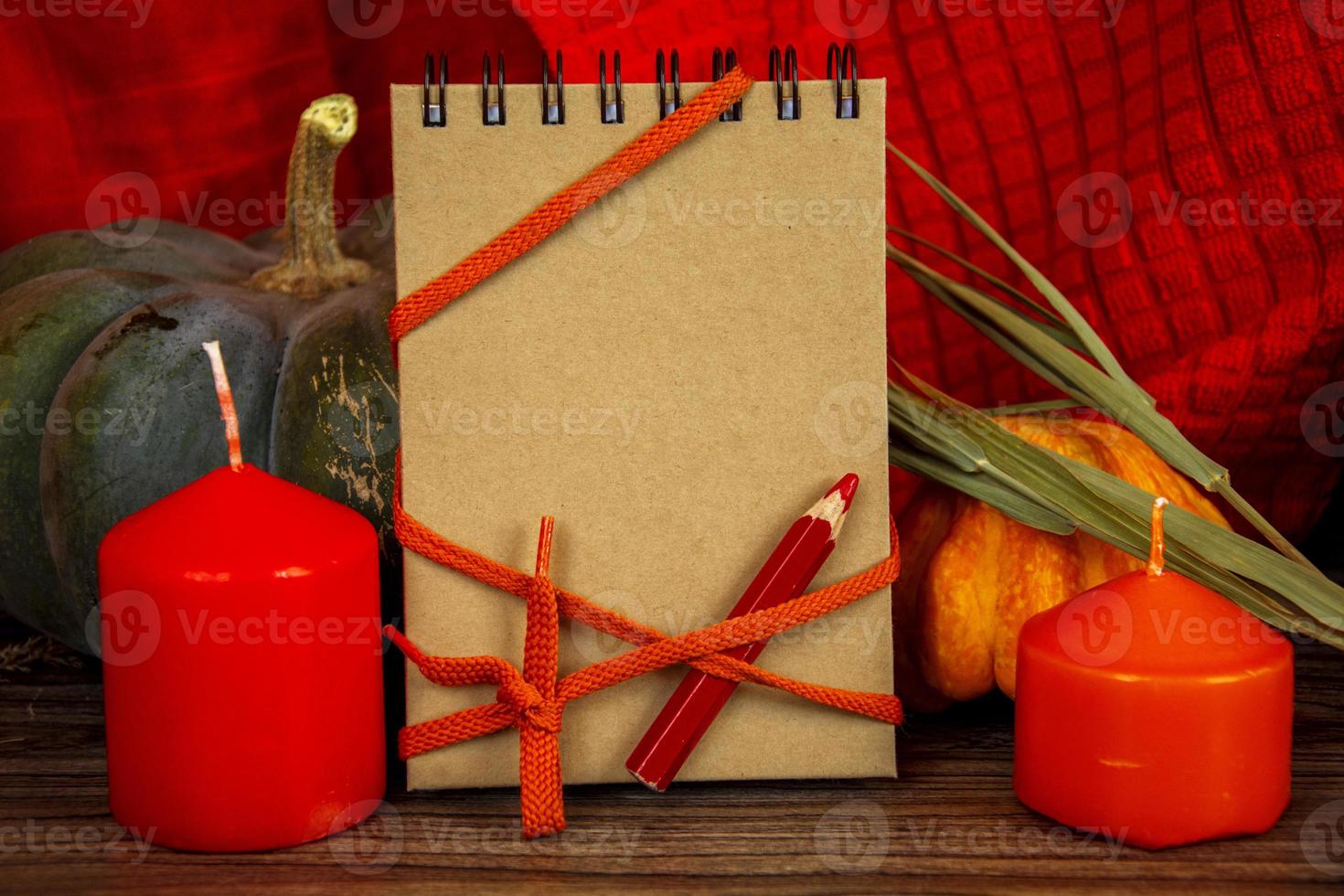 Autumn background with pumpkins and candles. Halloween card. photo