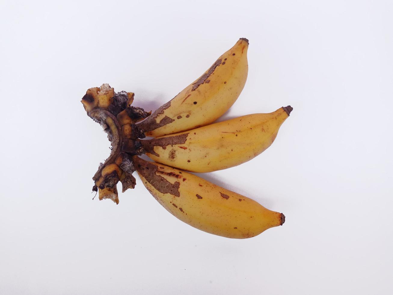 Top view landscape three yellow ripe bananas isolated on white background photo