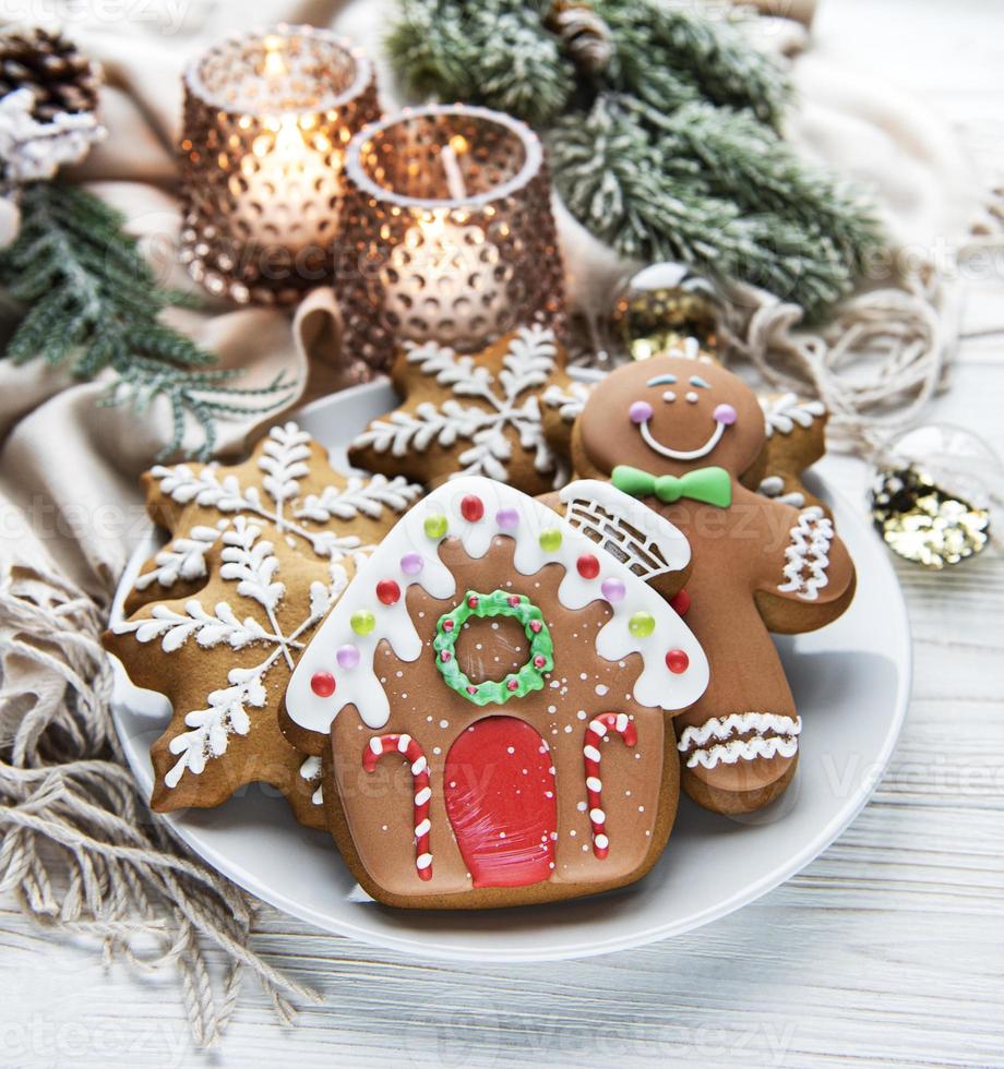 Christmas gingerbread in the plate on white. Top view. photo