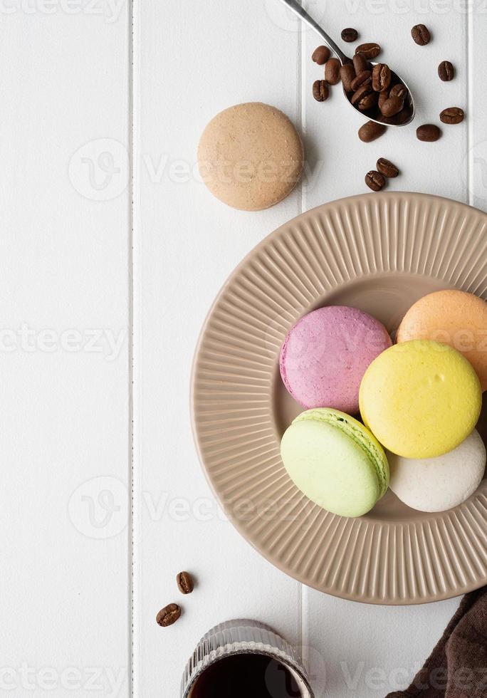 Flat lay macarons on the wooden table photo