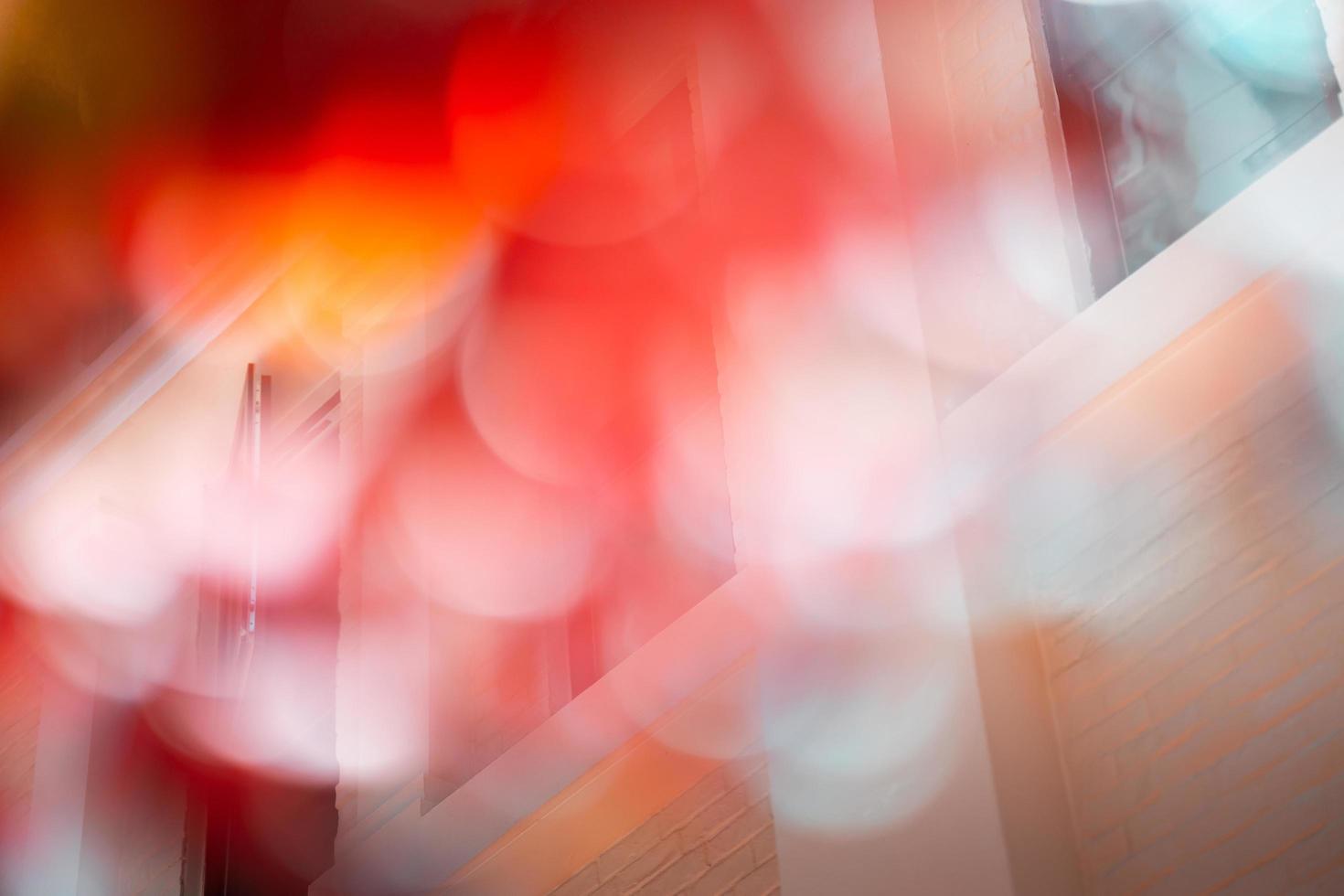 Bokeh blurred autumn romantic background, orange brick wall and window background. photo