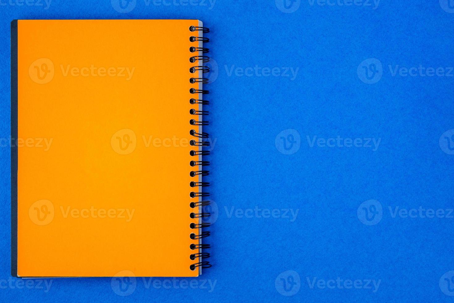 Yellow paper note on a blue background photo