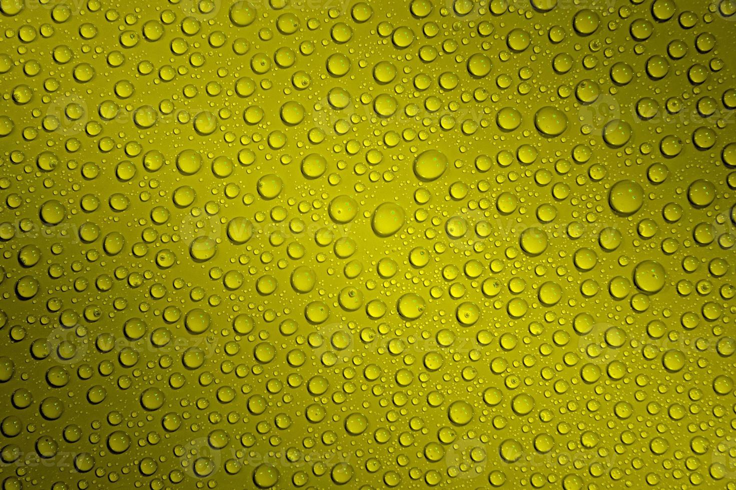 Wet with water drops dark red background with gradient illumination at two corners, closeup, details photo