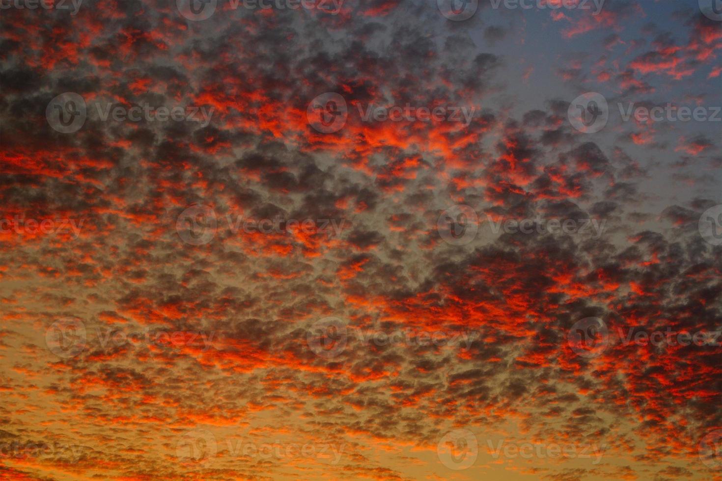 Beautiful bloody red skyline at sundown with different patterns for background, details photo