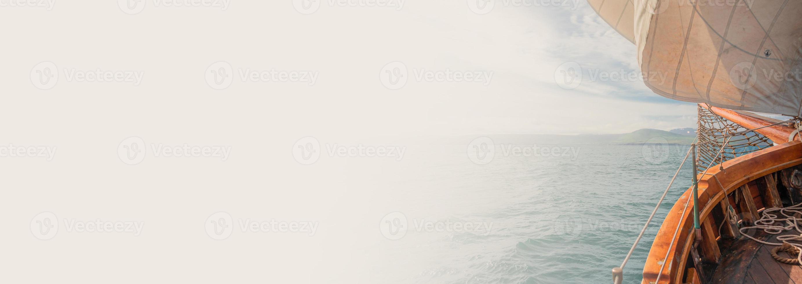 Banner with an old sailing boat towards dreams and adventures, with copy space for text. Concept travel, freedom and adventure, nomadic lifestyle. photo