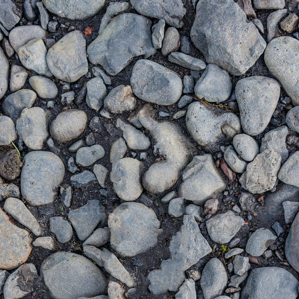 Round river pebbles as a background and texture, closeup, details. photo