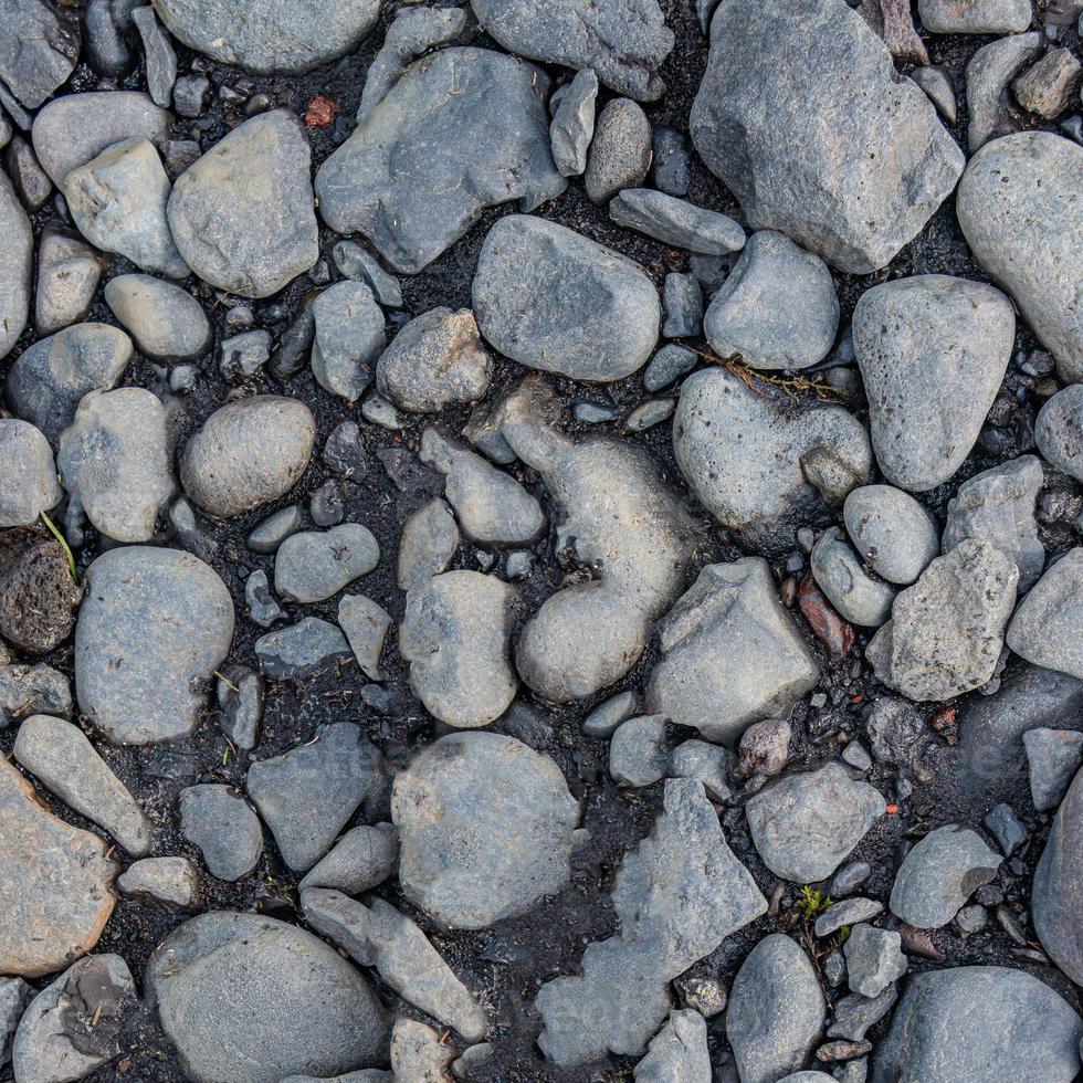 guijarros redondos de río como fondo y textura, primer plano, detalles. foto