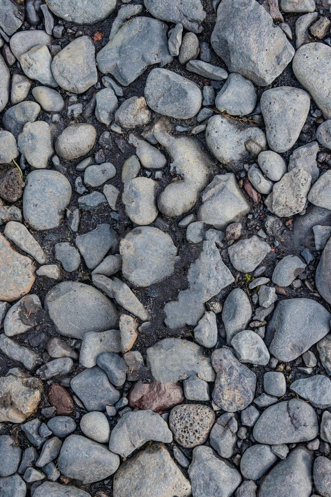 Round river pebbles as a background and texture, closeup, details. photo