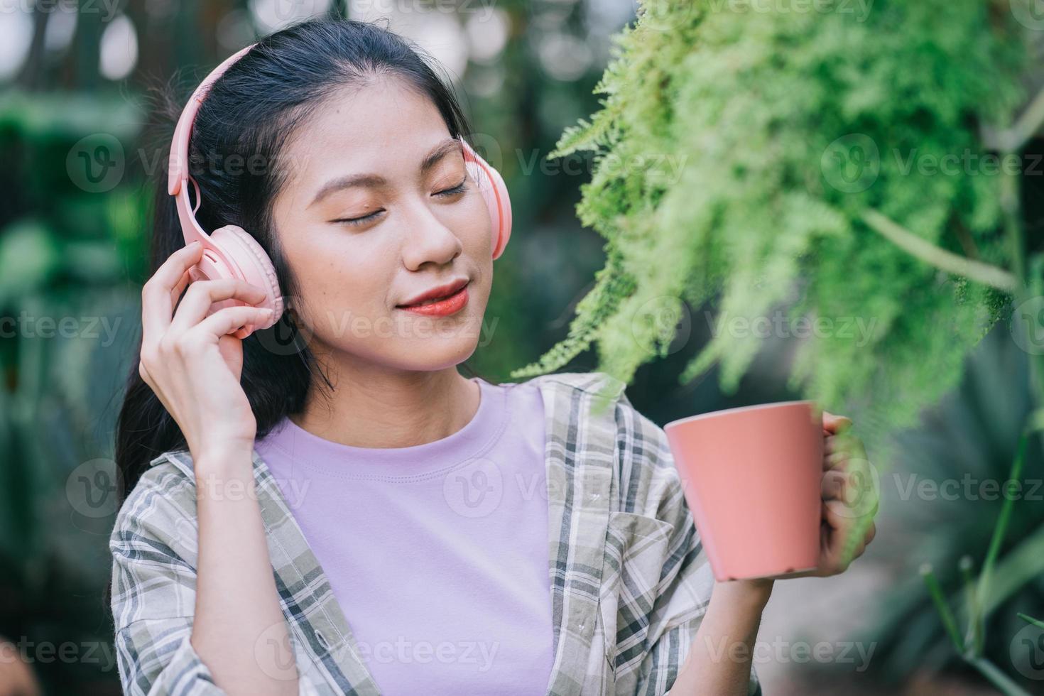 Young Asian woman drinking tea in the garden 4241253 Stock Photo at