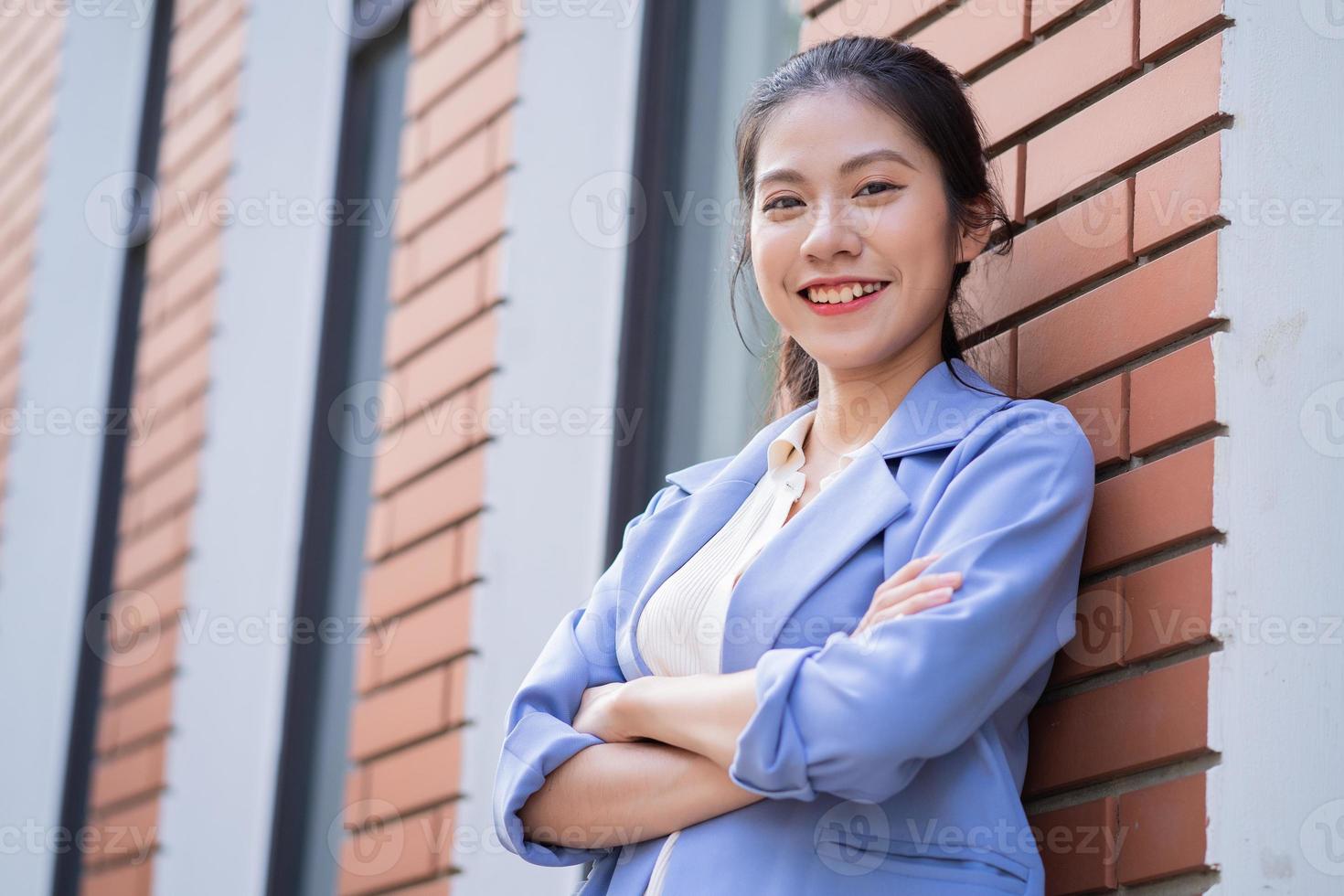 Young Asian woman working outside photo