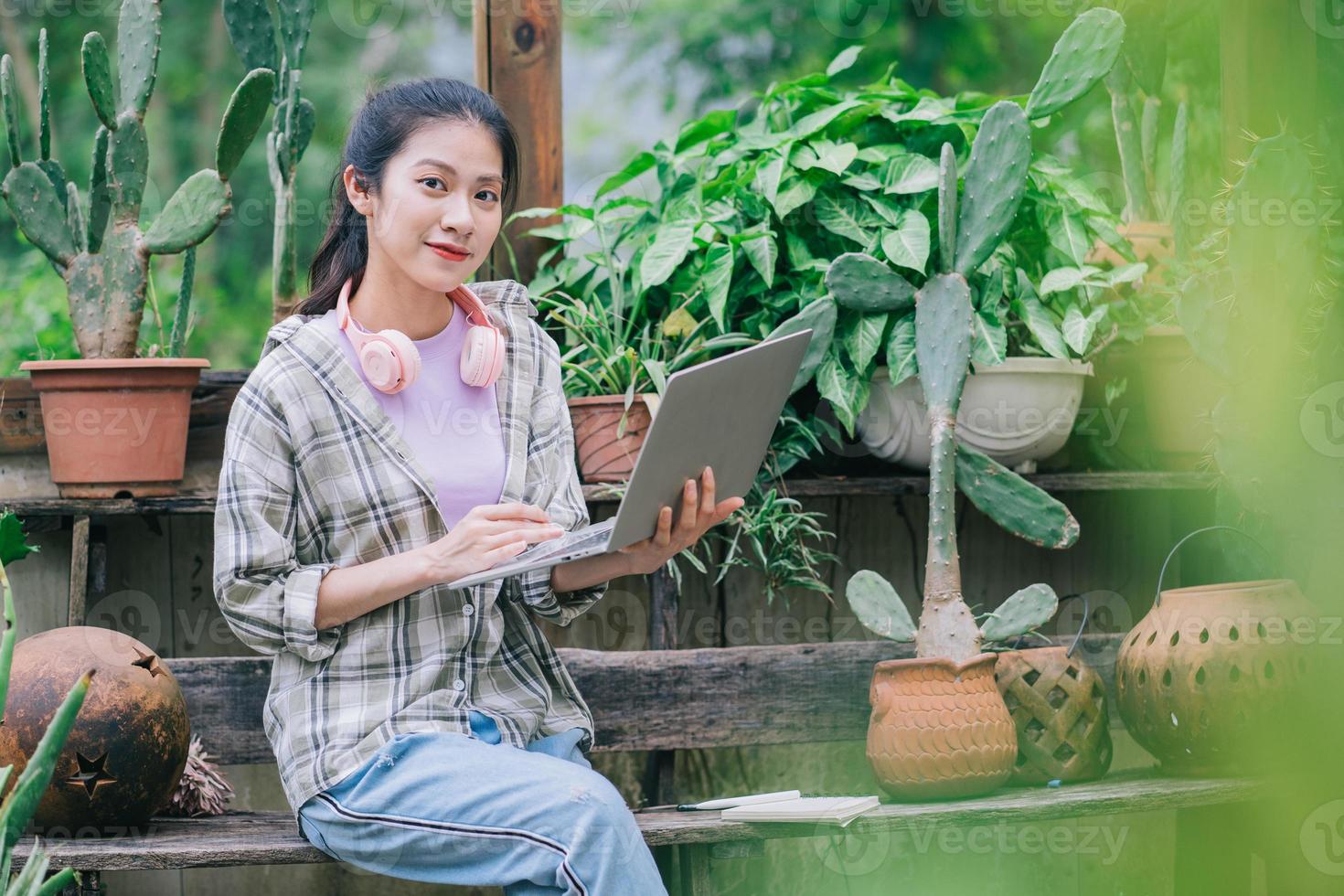Young Asian woman working in the garden photo