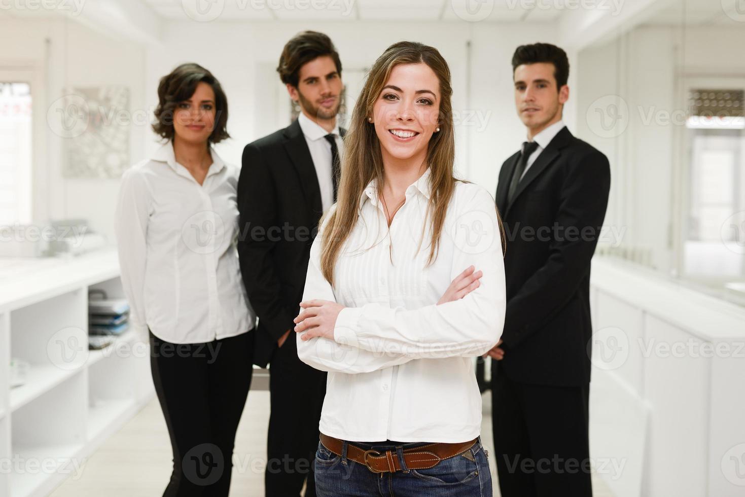 Business leader looking at camera in working environment photo