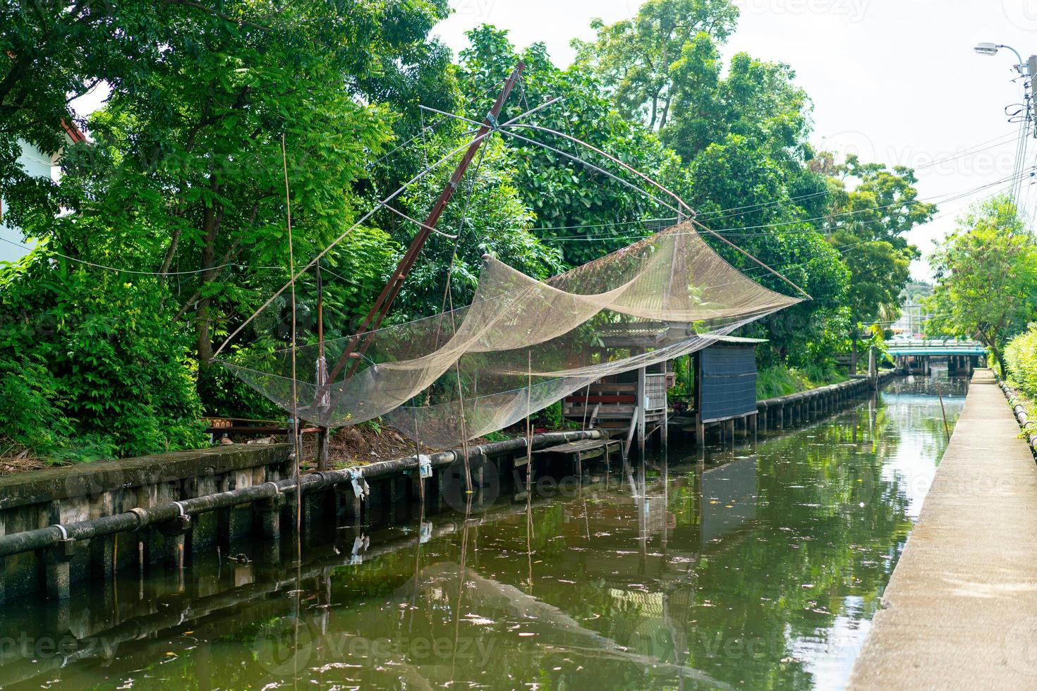 fishing nets hanging on canal photo